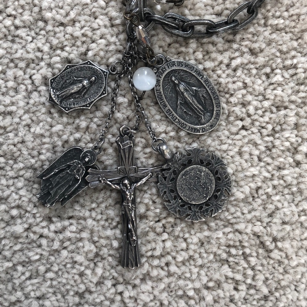 Statement necklace featuring collection of replicas of religious iconography.